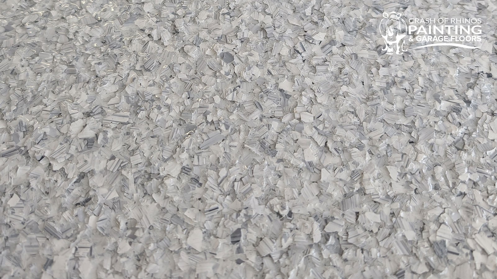 Close-up of a finished Schist (F9307) flake garage floor