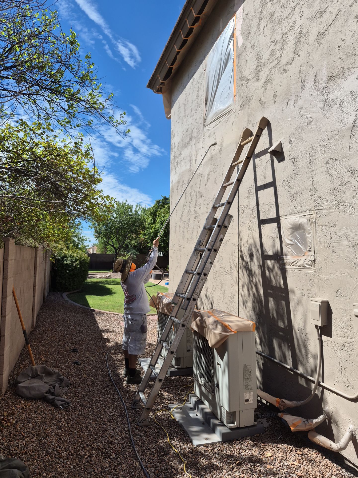 Crash of Rhinos employee washing a Peoria home before painting