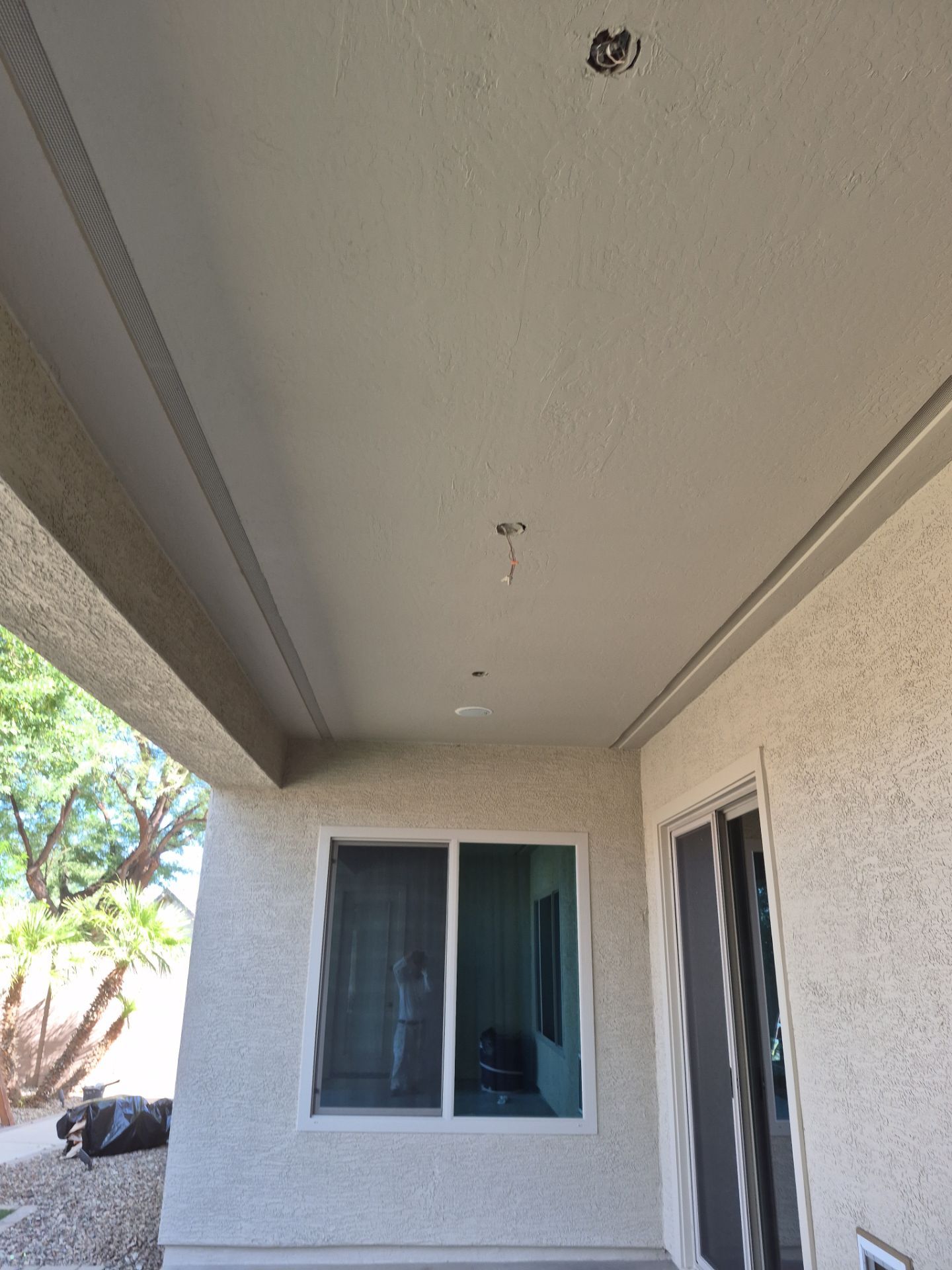 Finished patio ceiling on a Chandler home after repainting