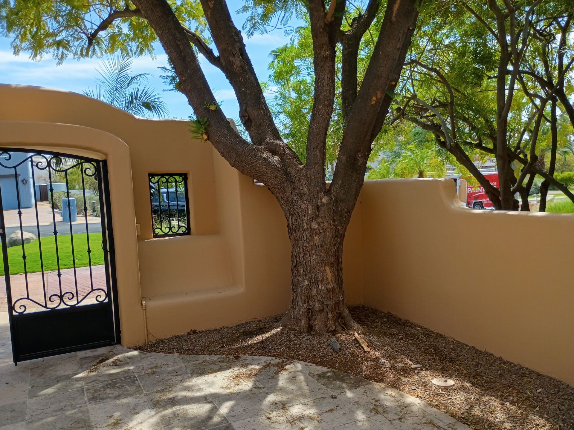 Finished courtyard wall and entry gate on a East Valley home