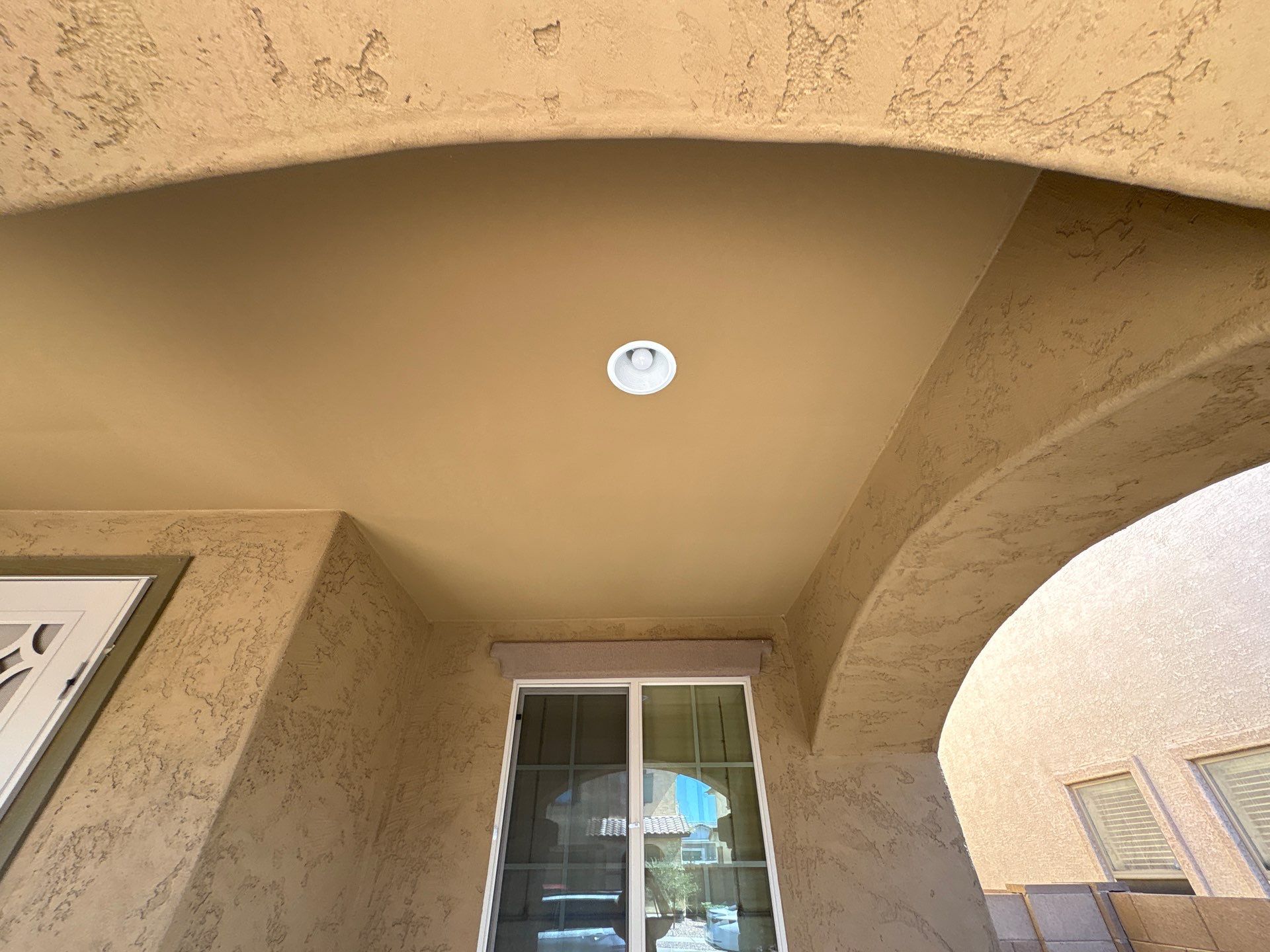 Covered entry ceiling and arch on a Glendale home before repainting