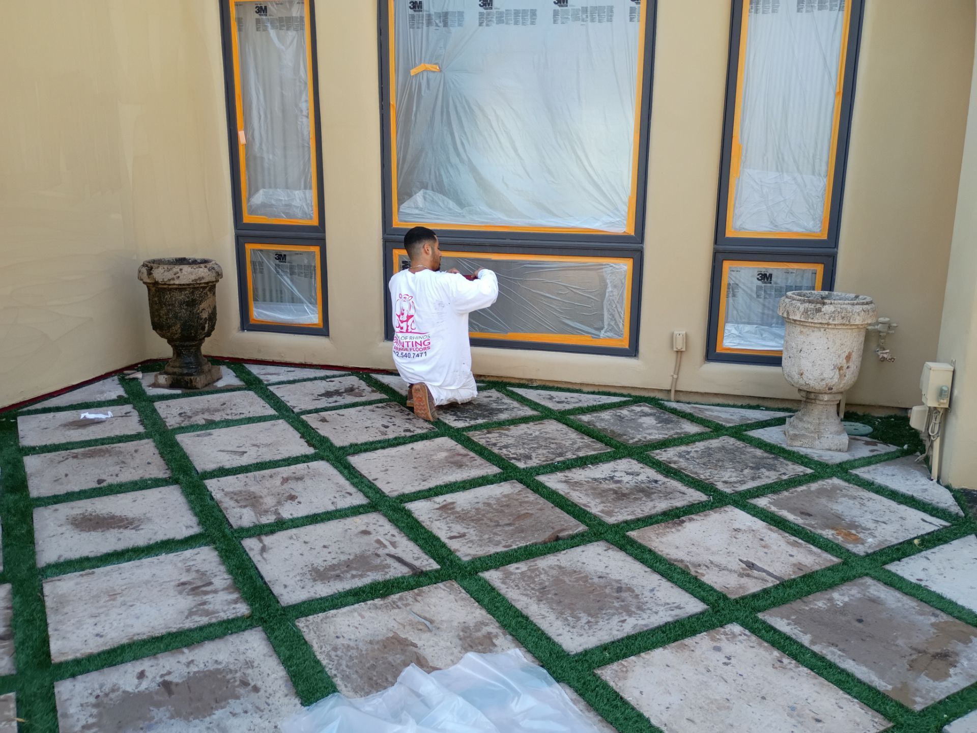 Crash of Rhinos employee masking windows on a East Valley home