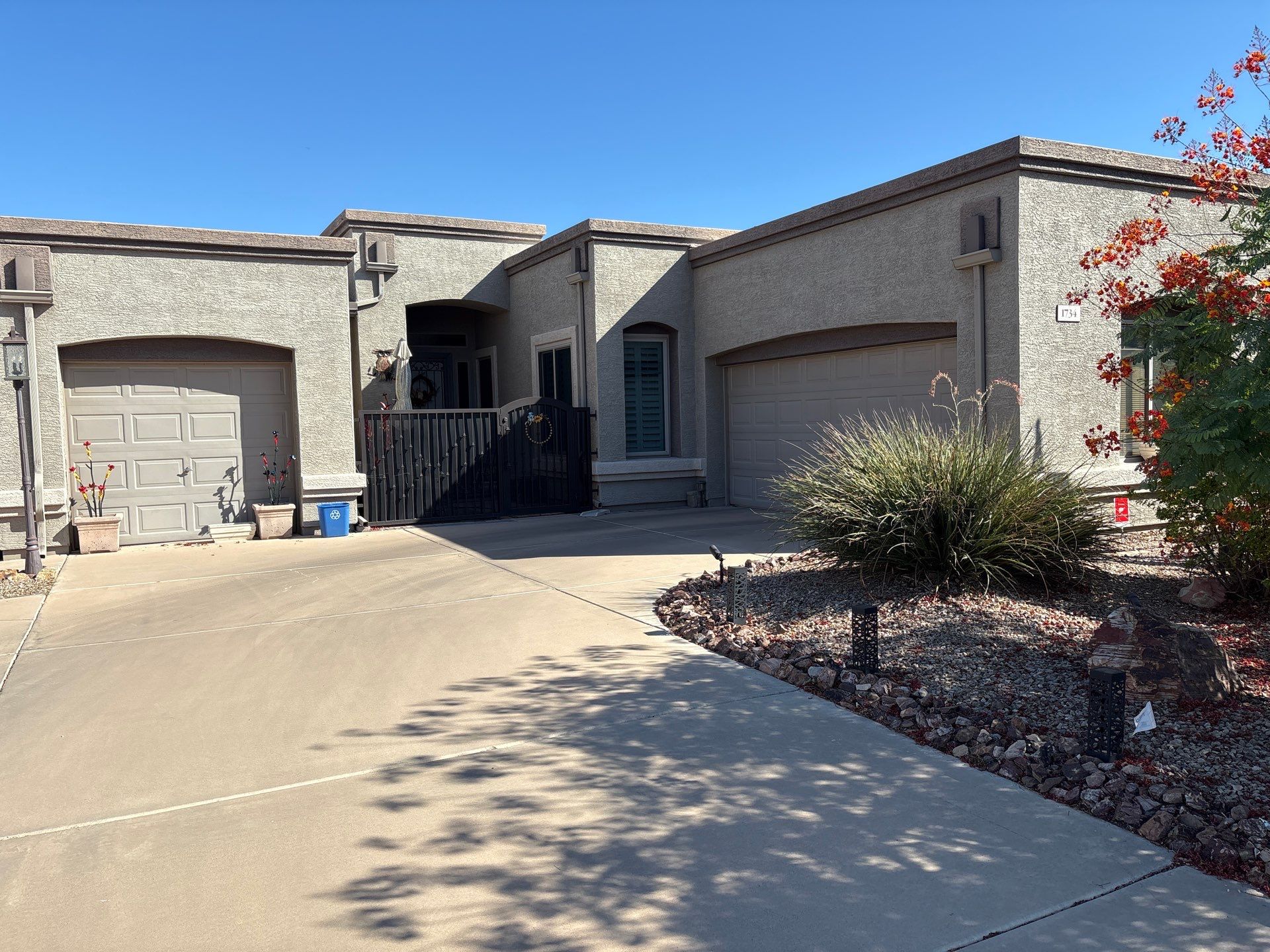 Gilbert home before painting, showing faded original stucco color