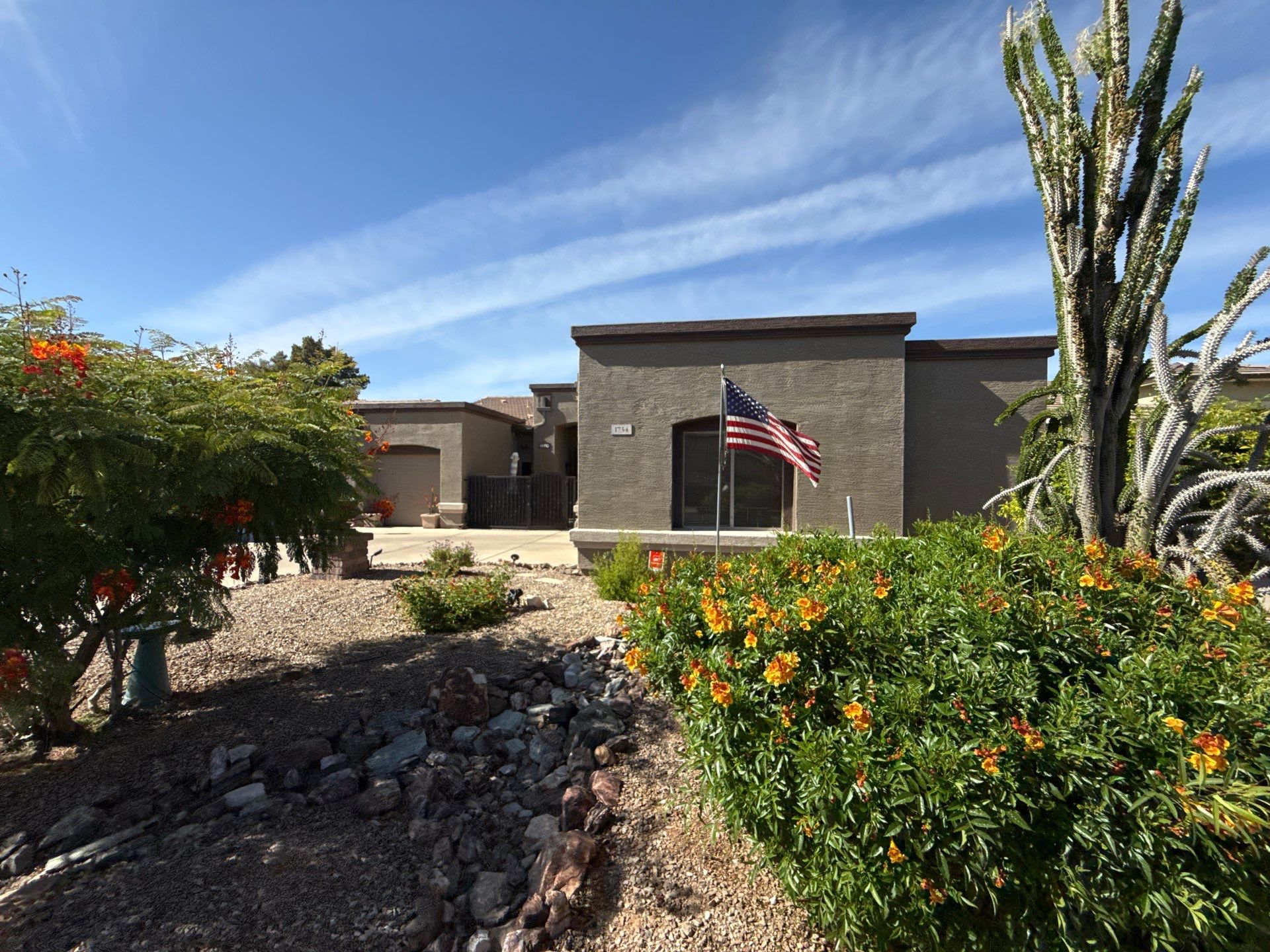 Repainted single-story Gilbert home in a dark charcoal body color