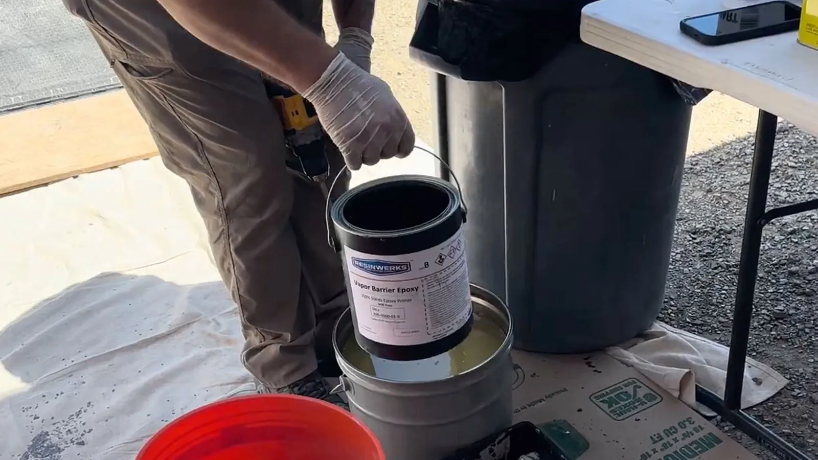 Resinwerks Vapor Barrier Epoxy primer being opened before mixing