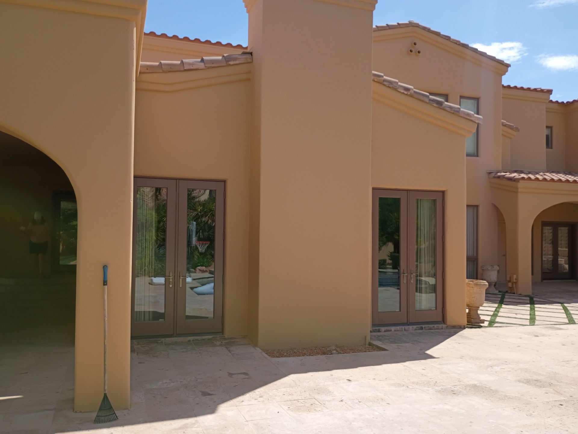 Finished courtyard elevation and repainted doors on a East Valley home