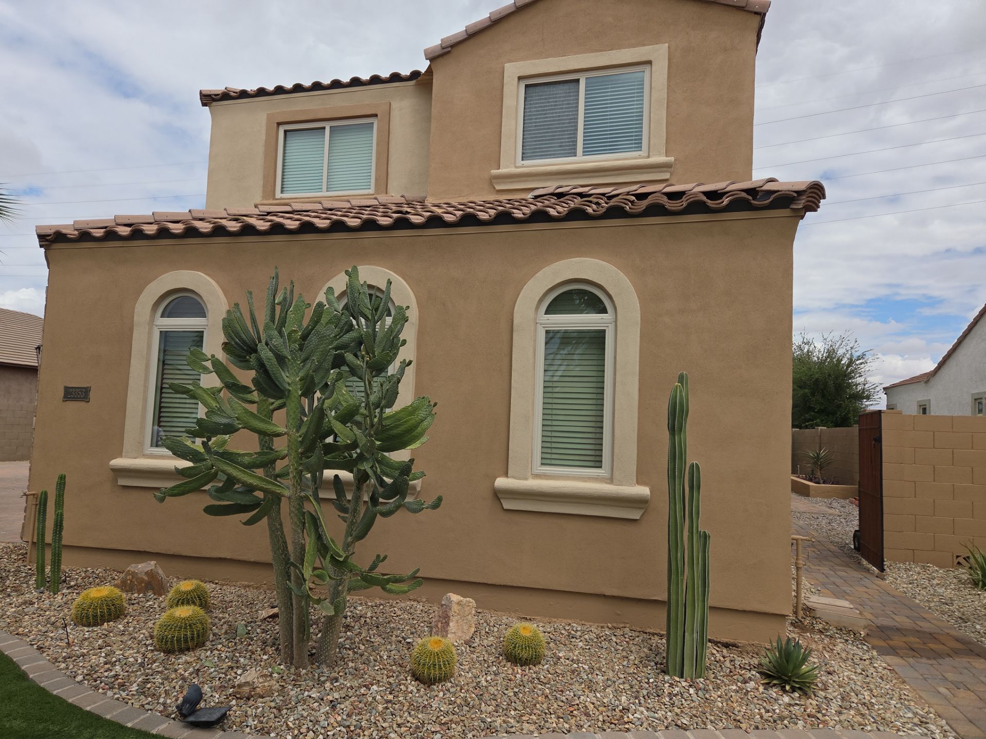 Finished arched-window elevation on a Queen Creek home