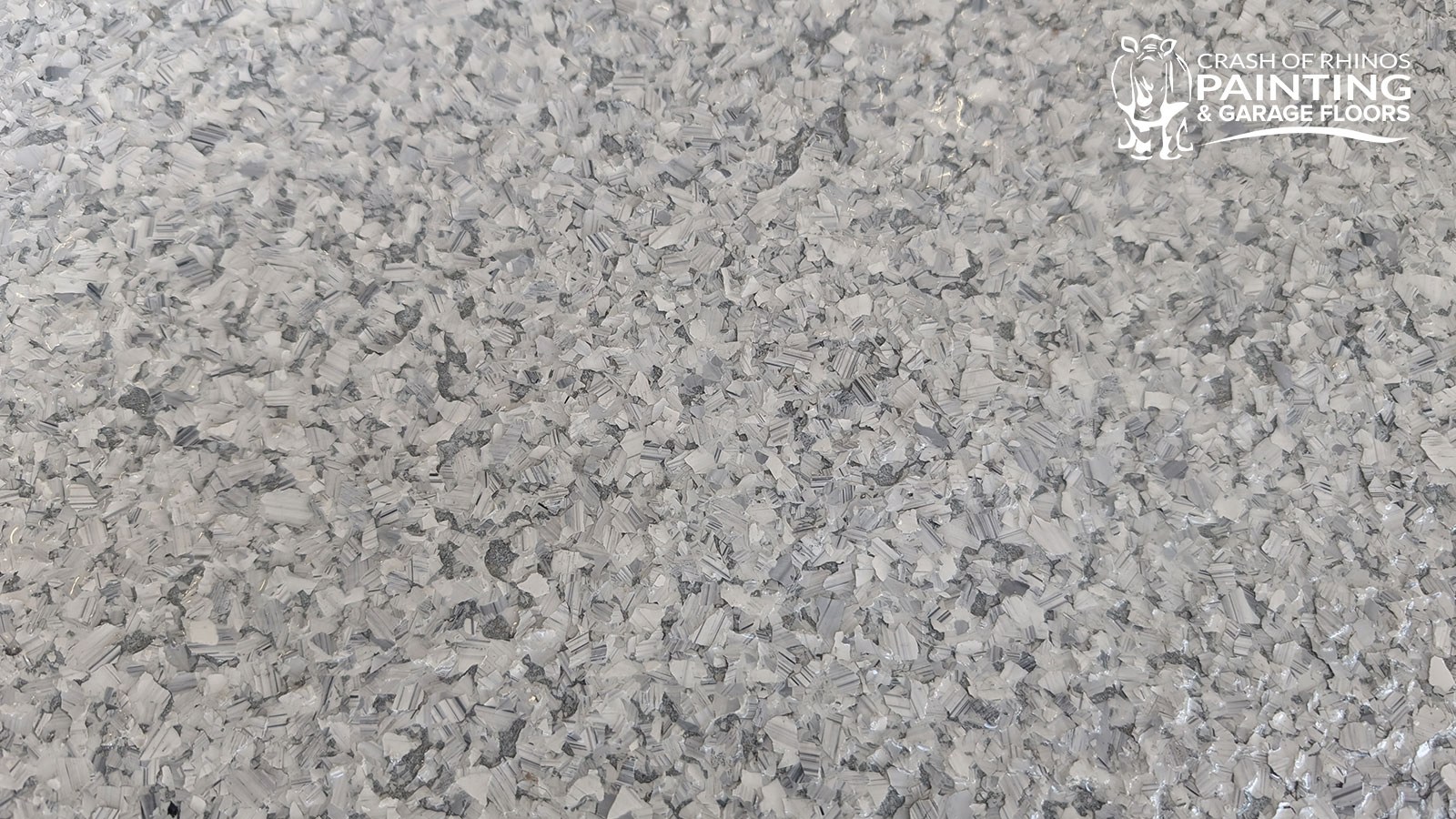 Close-up of a finished Schist (F9307) flake garage floor