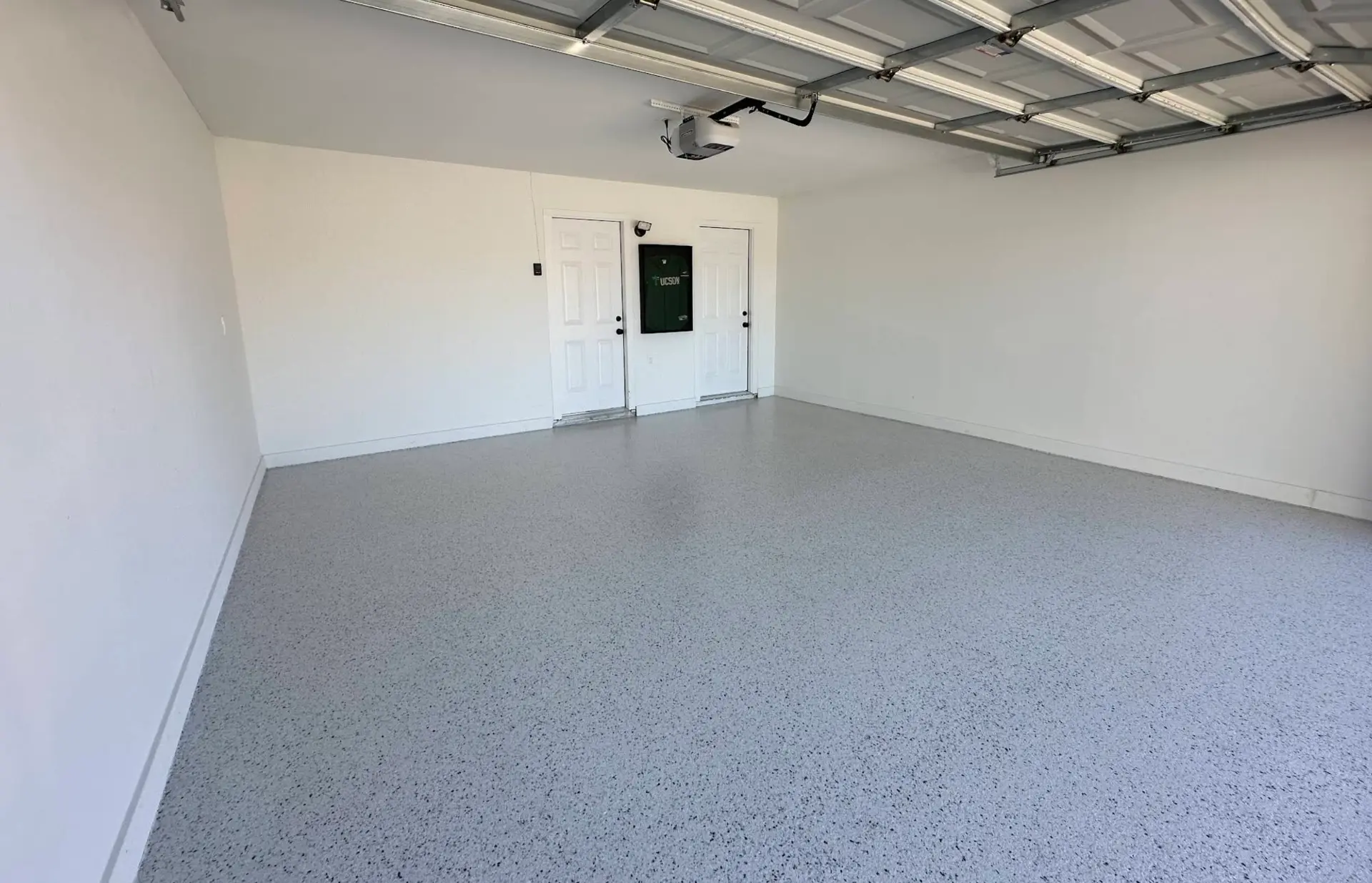 Speckled gray epoxy garage floor installed by Crash of Rhinos