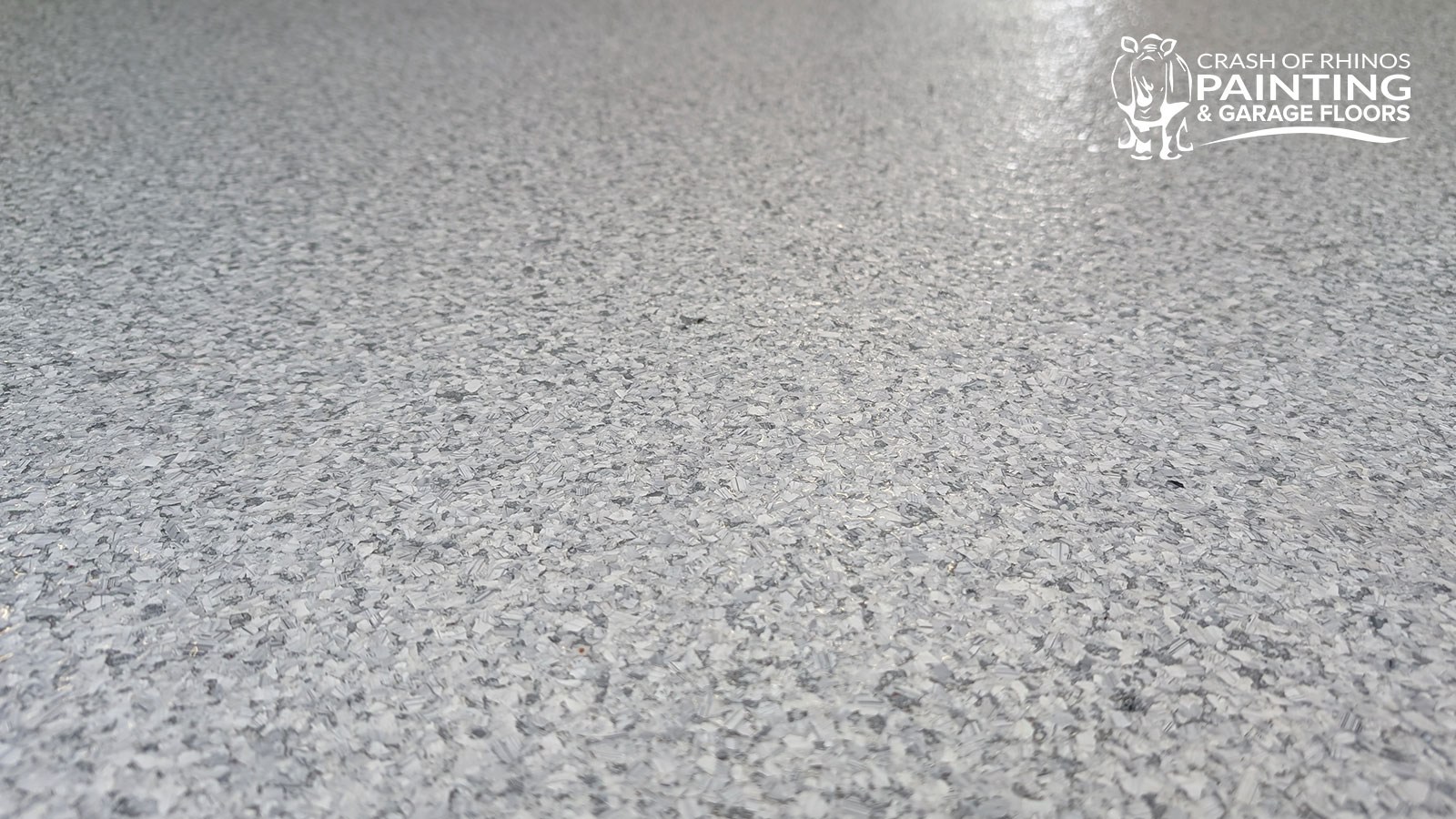 Close-up of a finished Schist (F9307) flake garage floor