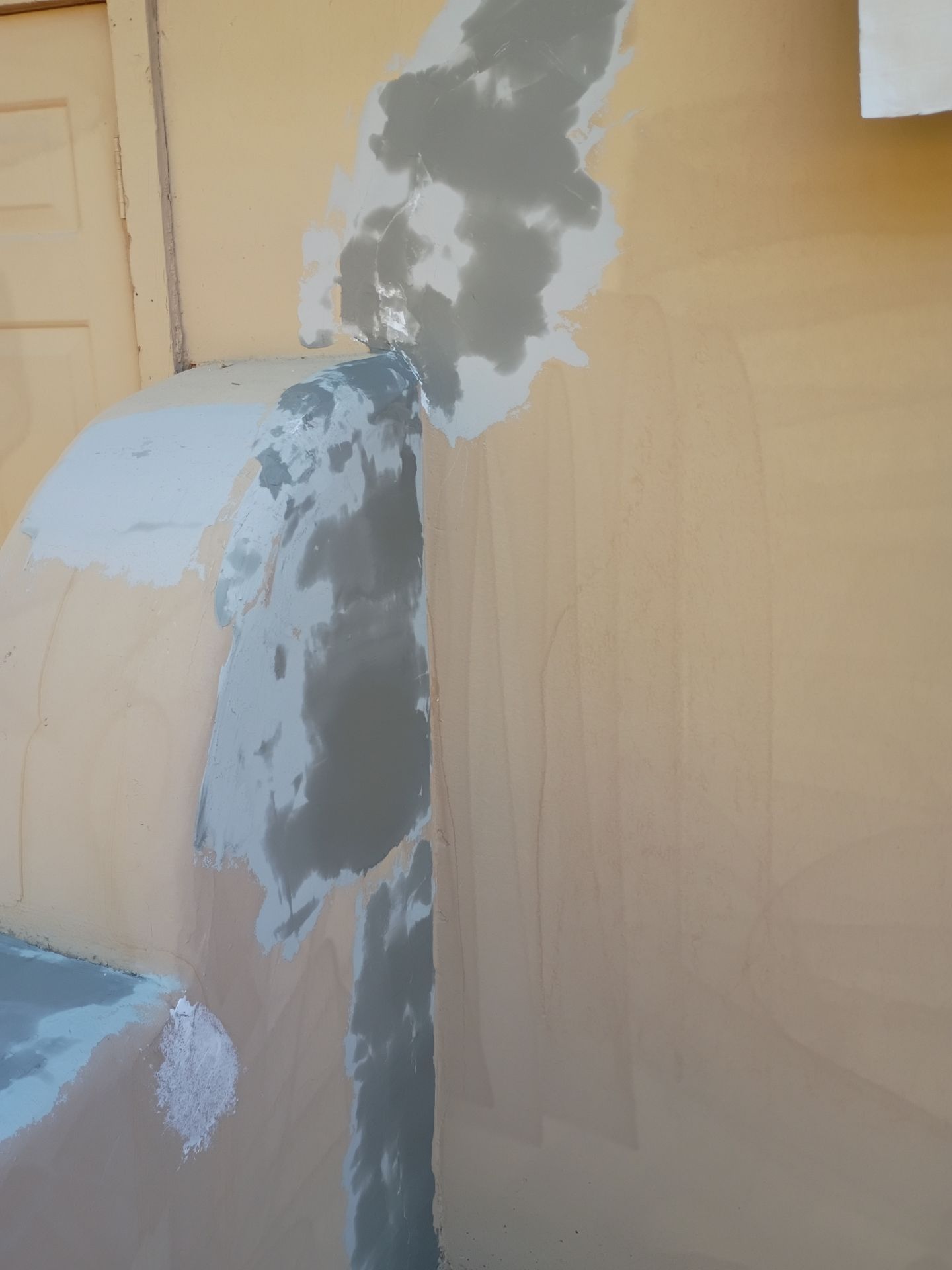 Patched and primed stucco crack on a East Valley exterior wall
