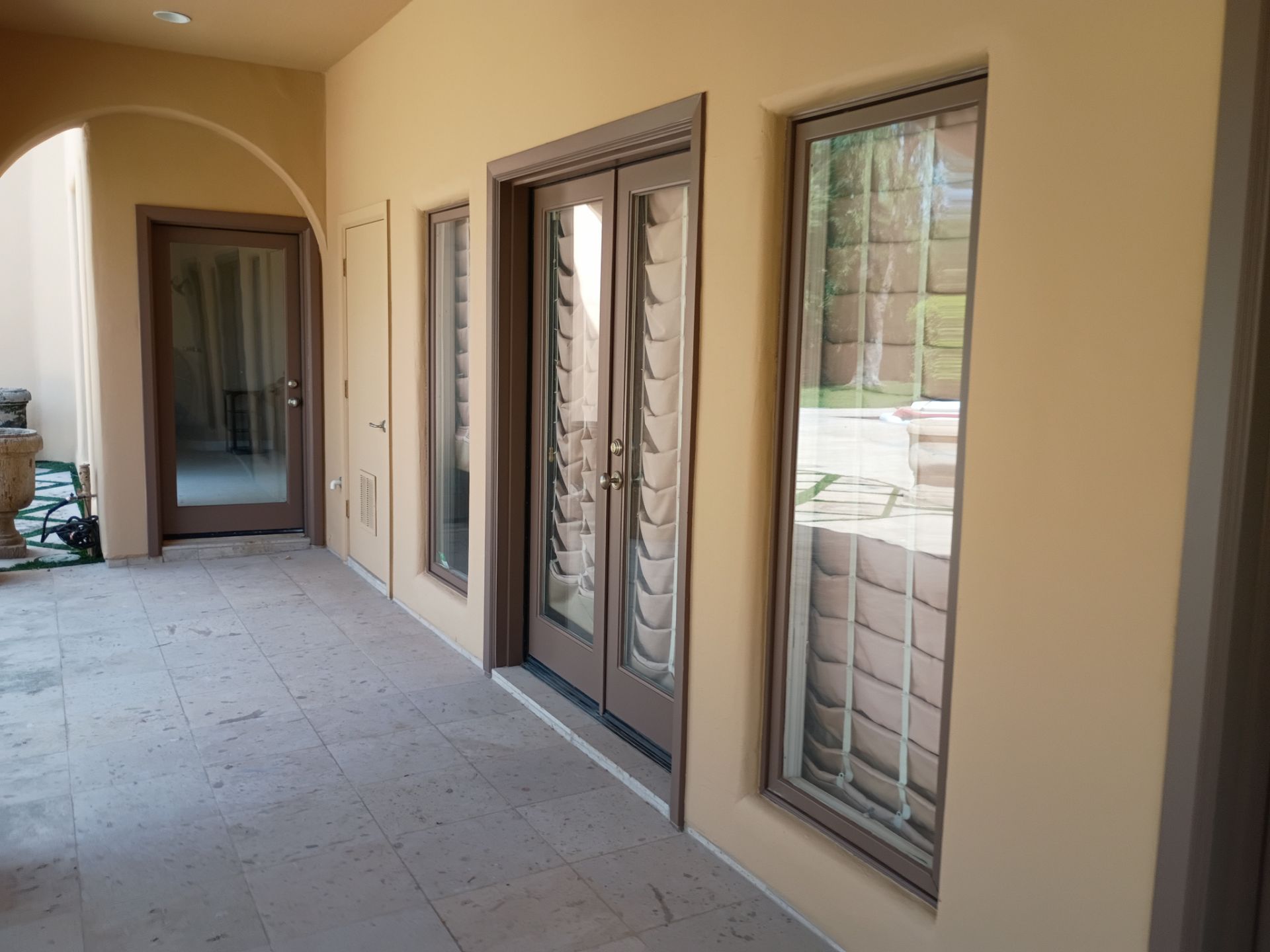 Repainted covered walkway, doors, and trim on a East Valley home
