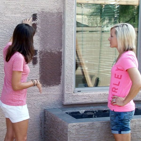 Our Professional Color Consultant reviews some exterior paint samples with a local homeowner, advising them on their options.