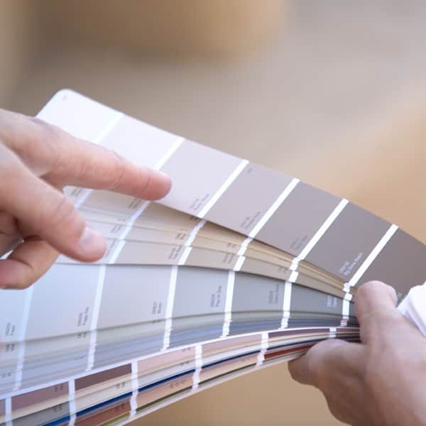 Choosing exterior paint colors from a fan deck