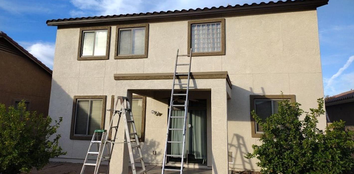 Two-story home after exterior painting