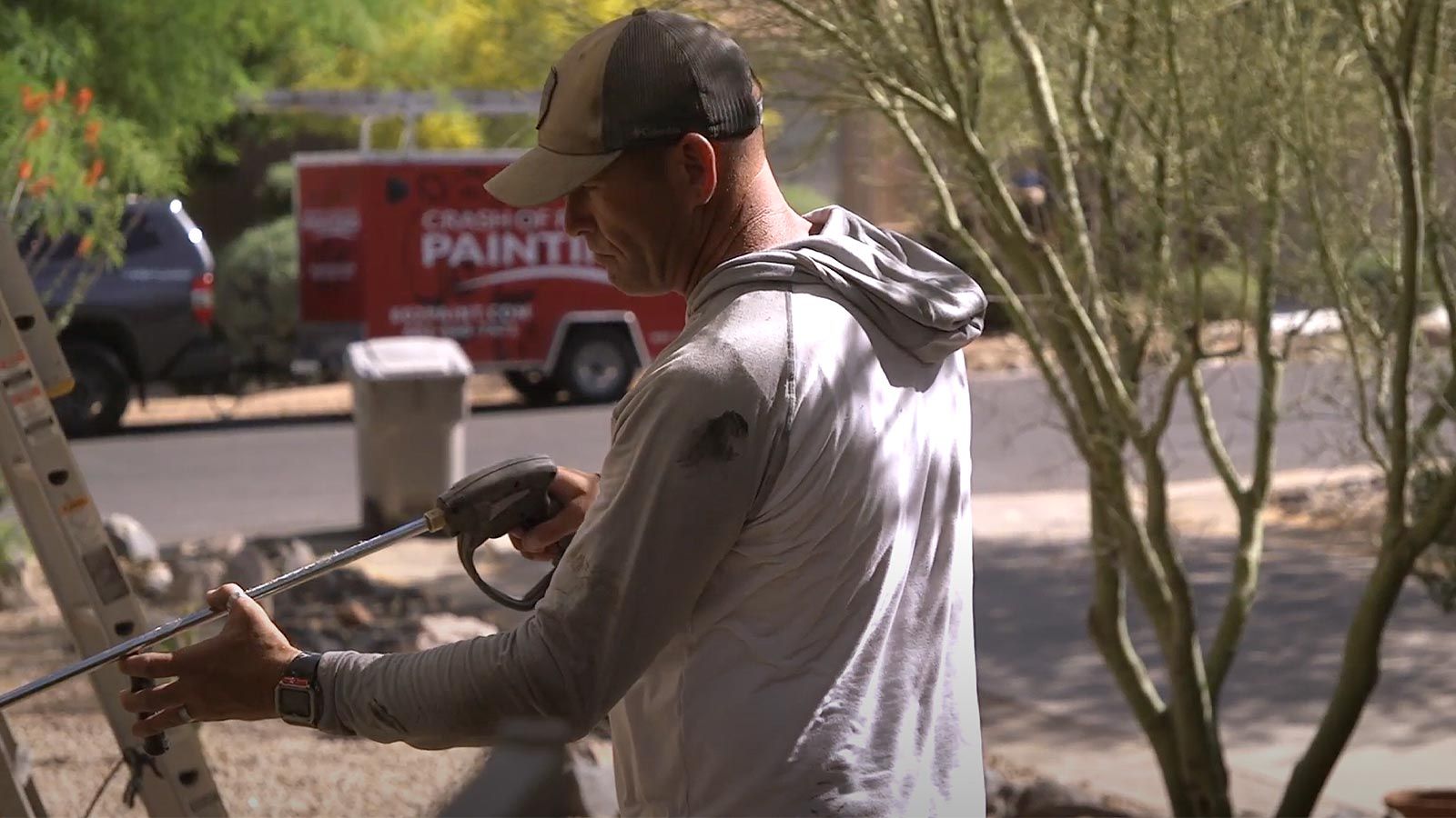 Pressure washing a home before painting