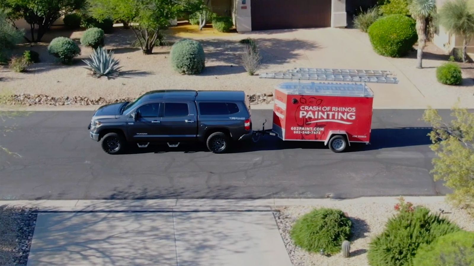 Crash of Rhinos Painting truck parked at a residential job site in Phoenix