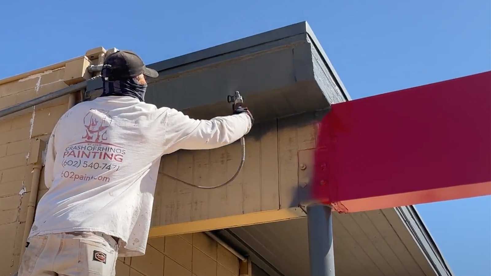 Crash of Rhinos crew painting a commercial exterior in Phoenix