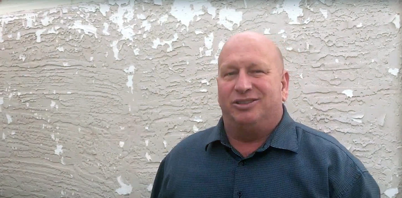 What does peeling paint on your stucco home indicate?