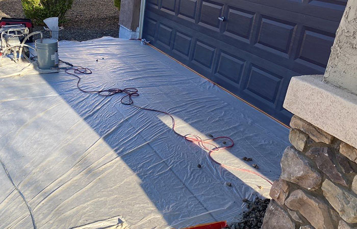 protecting-driveway-with-plastic