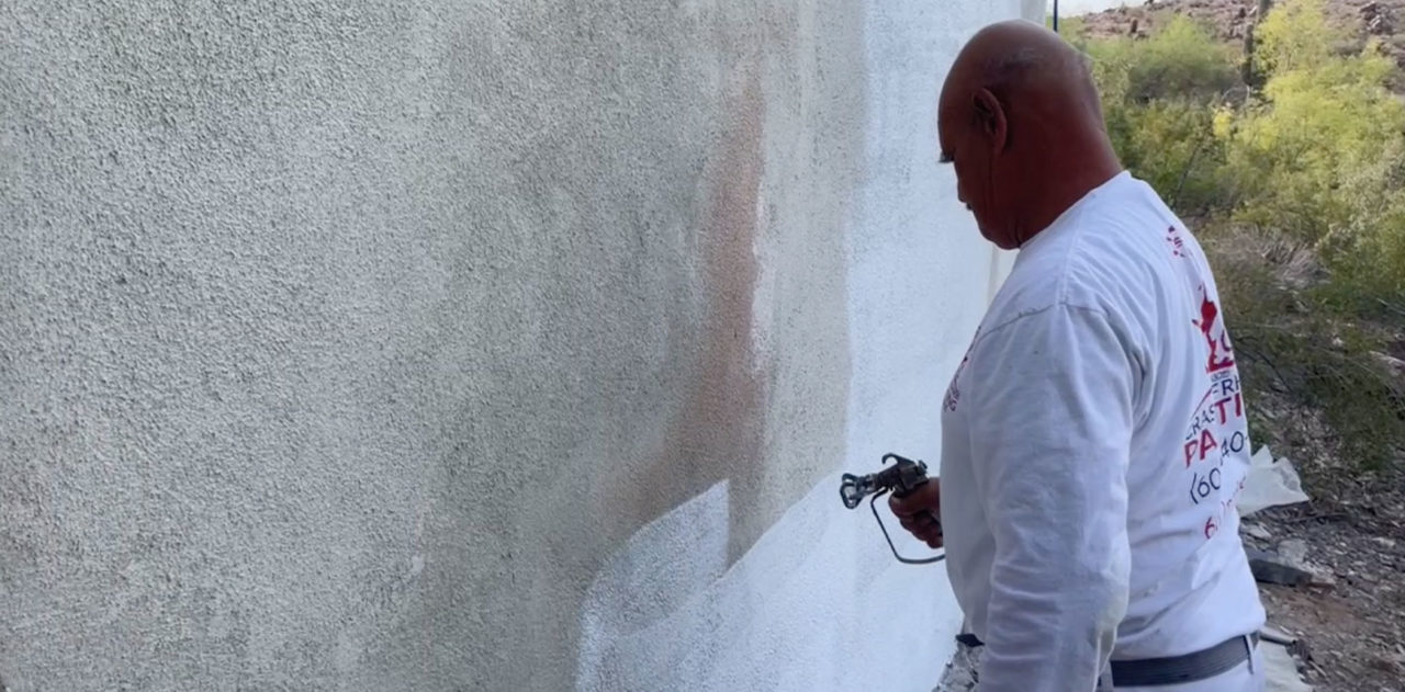 priming-a-stucco-patch-on-a-retaining-wall